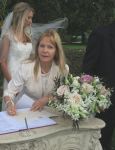 celebrant signing the registry