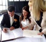 signing the marriage certificate Novotel Manly