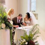 “Couple signing legal marriage documents at Lords Estate Sydney”